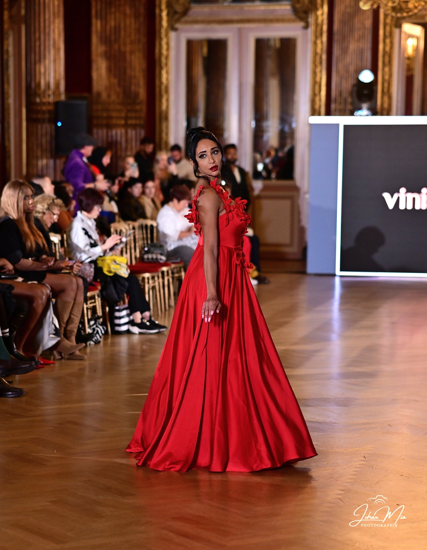 Show-Stopping Red Gown with Floral Appliqué Detailing