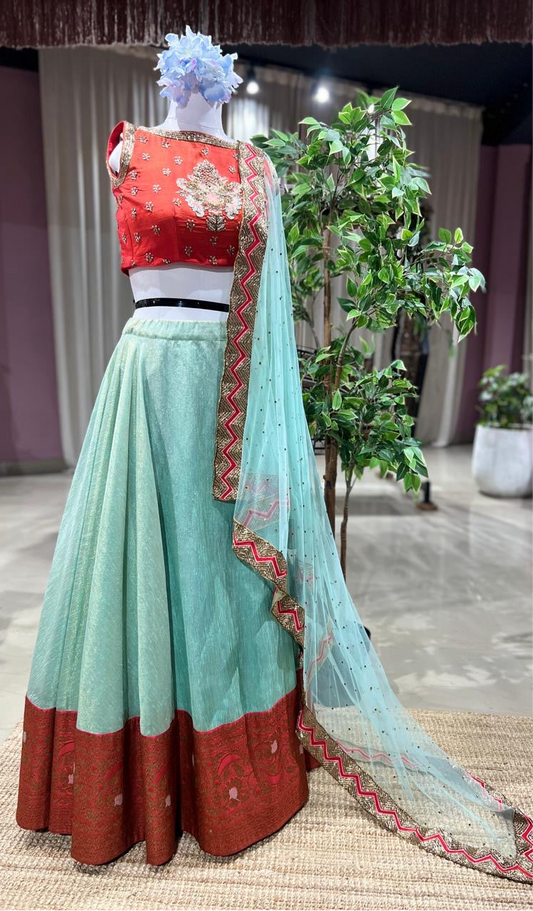 Cherry Mist – Aqua Banarasi Tissue Lehenga with Red Embroidered Blouse & Net Dupatta